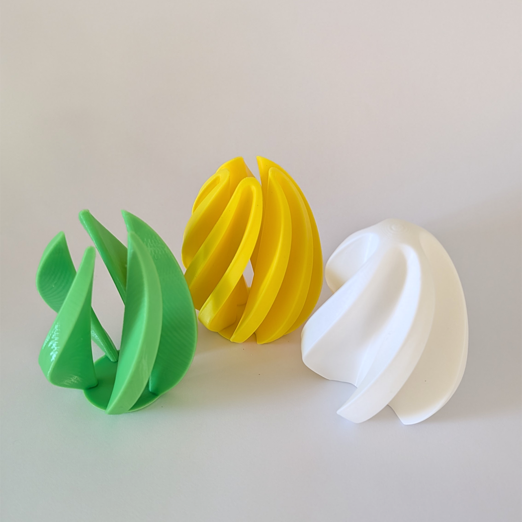 Three colorful plastic items on a light gray background