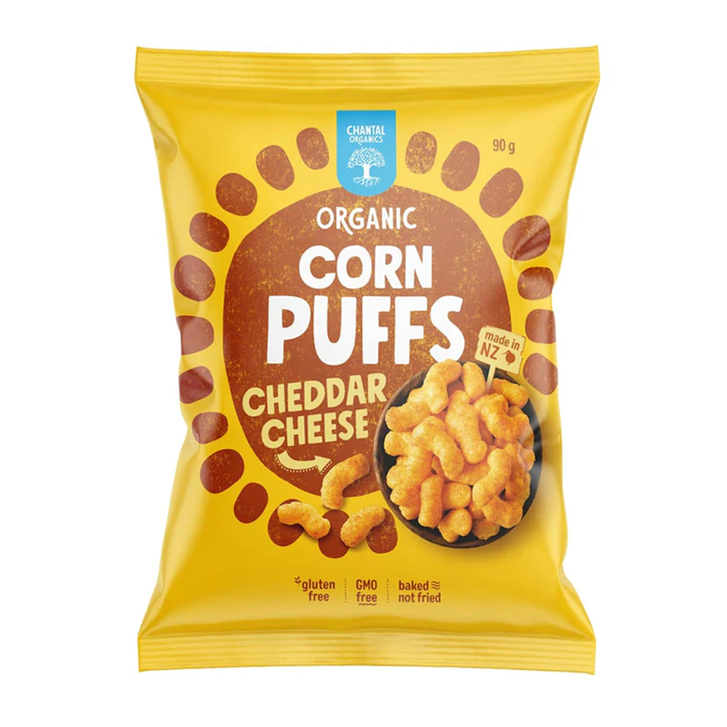 Packaging of organic corn puffs with cheddar cheese flavor on a white background
