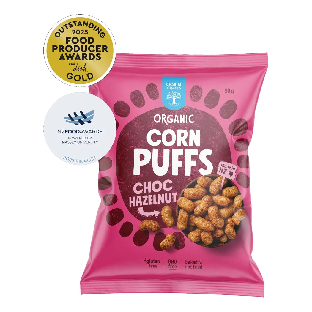 Pink package of organic corn puffs with choco hazelnut flavor on a white background