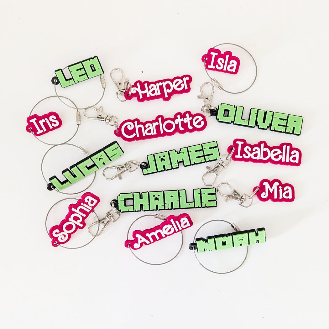 Keychains with names in various colors on a white background
