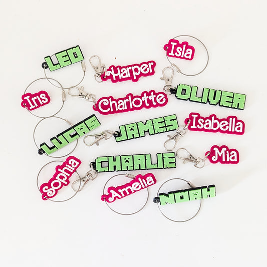 Keychains with names in various colors on a white background