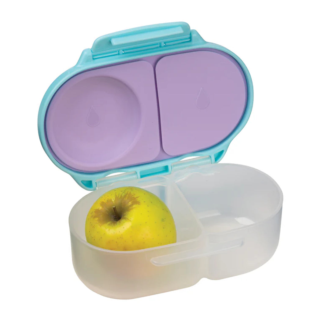 Portable snack container with a yellow apple inside on a white background