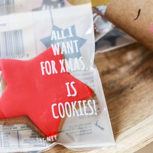 Cookie package with a red star and text on a wooden surface