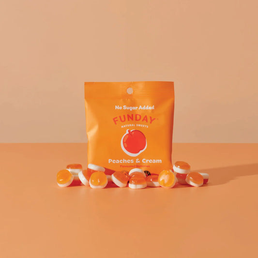 Funday peaches and cream gummy bears with an orange package on a peach background