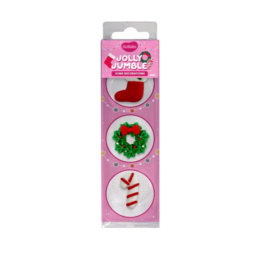 Pack of Christmas-themed icing decorations with a pink packaging featuring illustrations of a candy cane, wreath, and stocking.