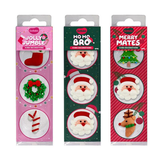 Three packages of Christmas-themed icing decorations with festive designs on a white background.