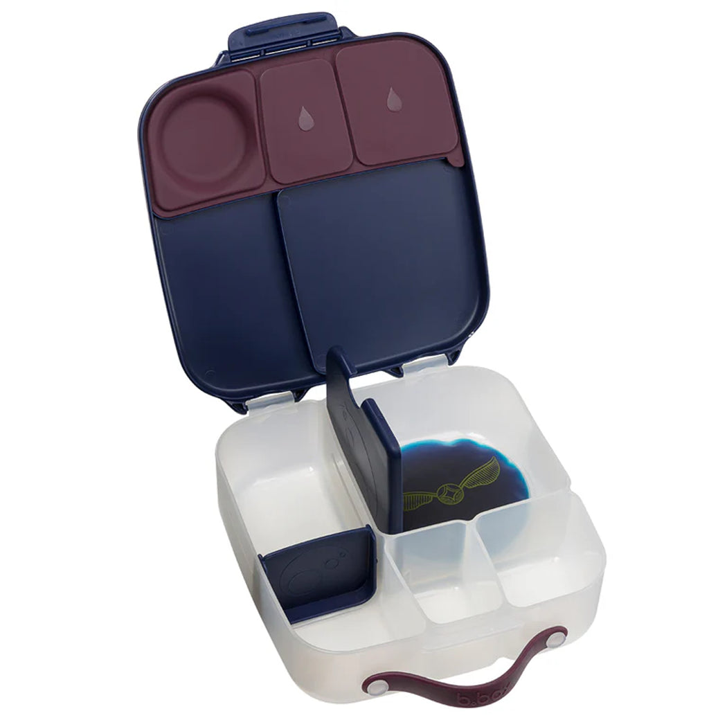 Multi-compartment food container with compartments for food and drinks on a white background