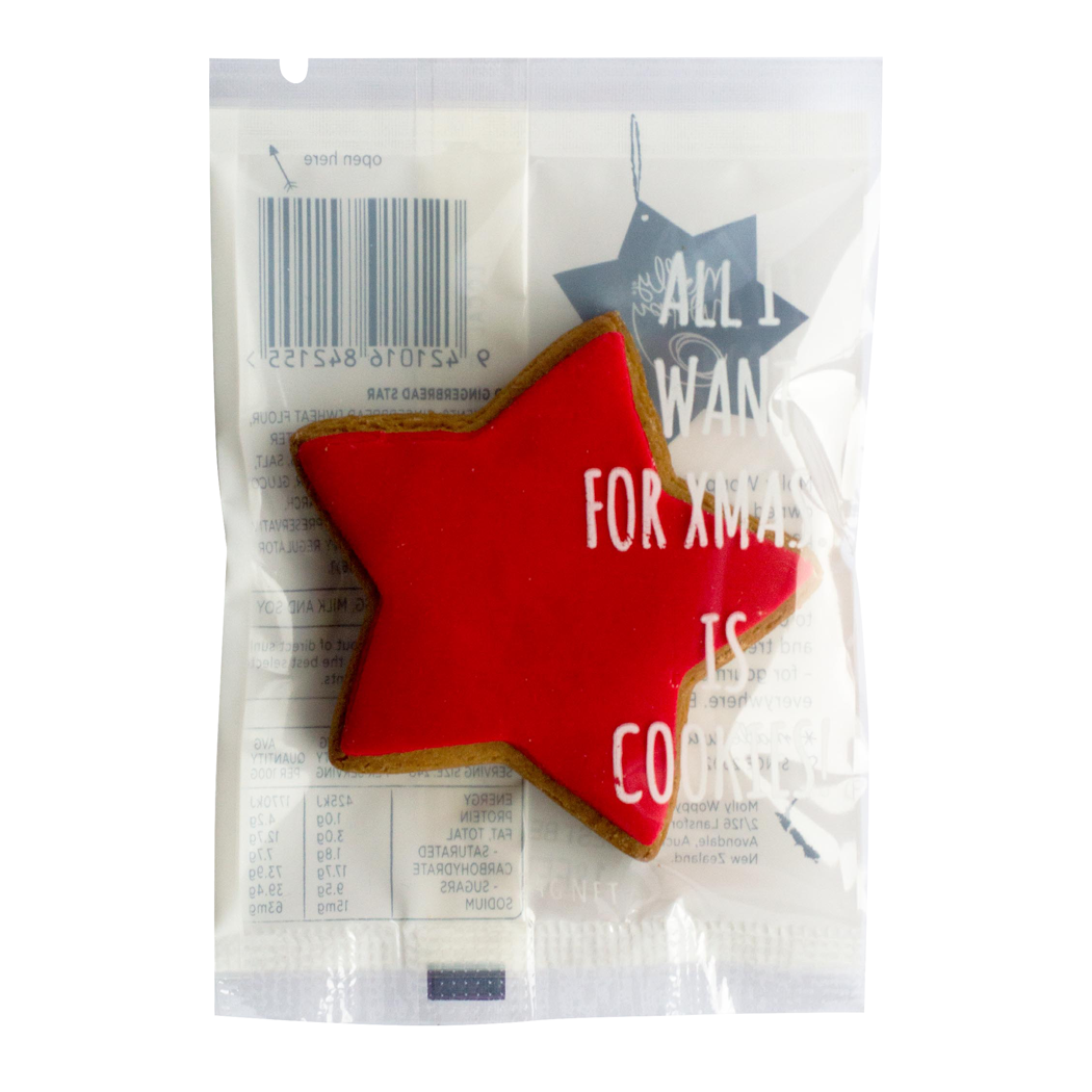 Red star-shaped cookie with text in a clear package on a white background