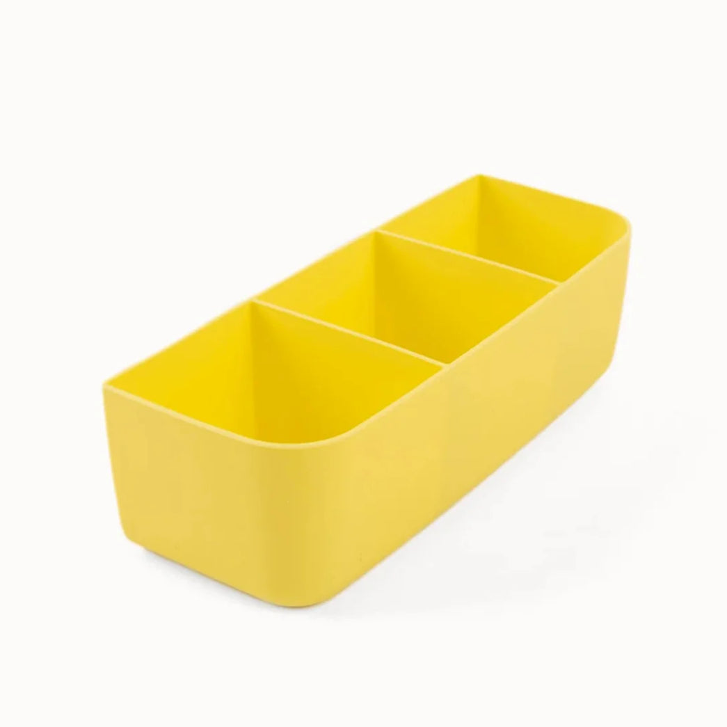 Yellow rectangular container with compartments on a white background