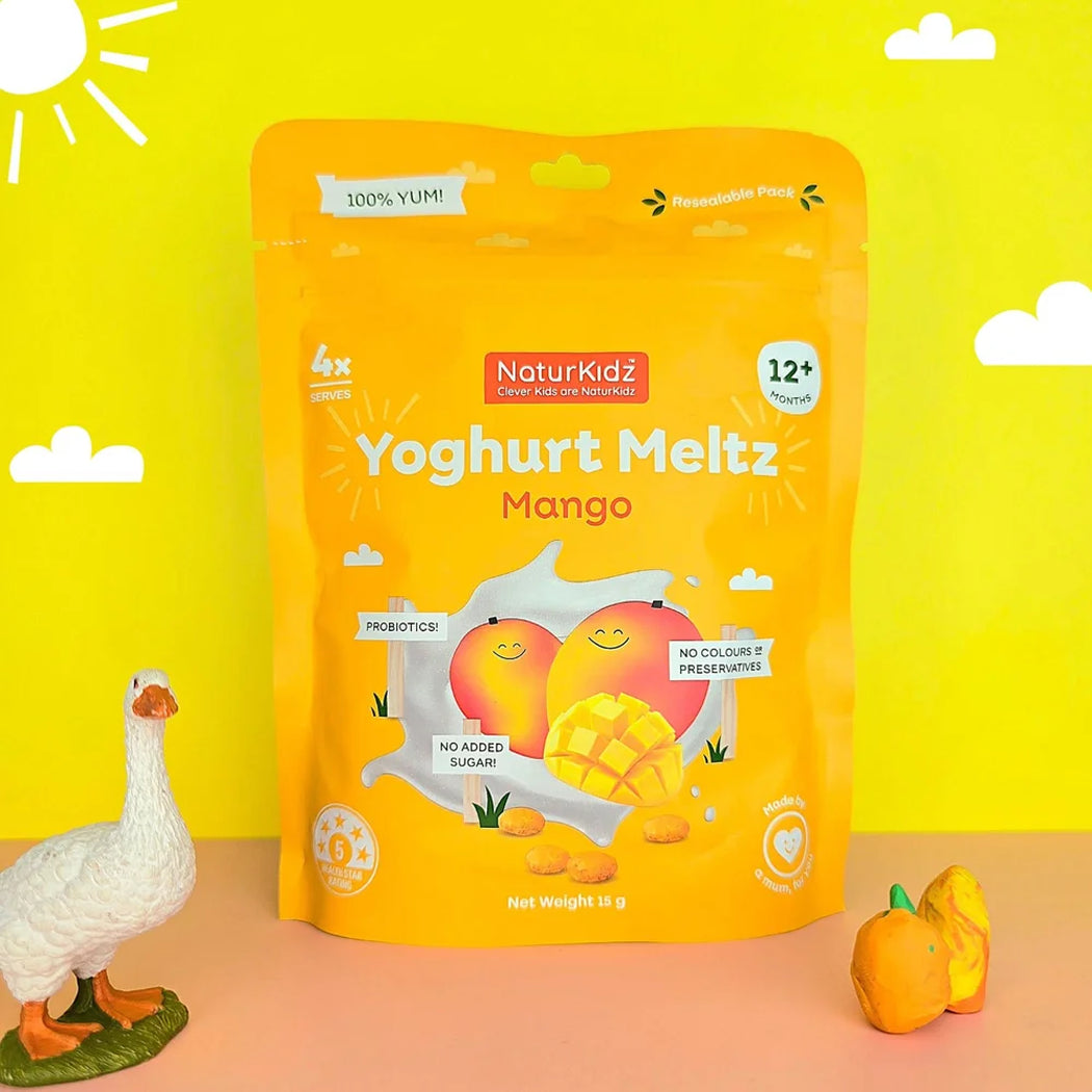 NaturKidz Yoghurt Meltz Mango package on a yellow background with decorative elements.