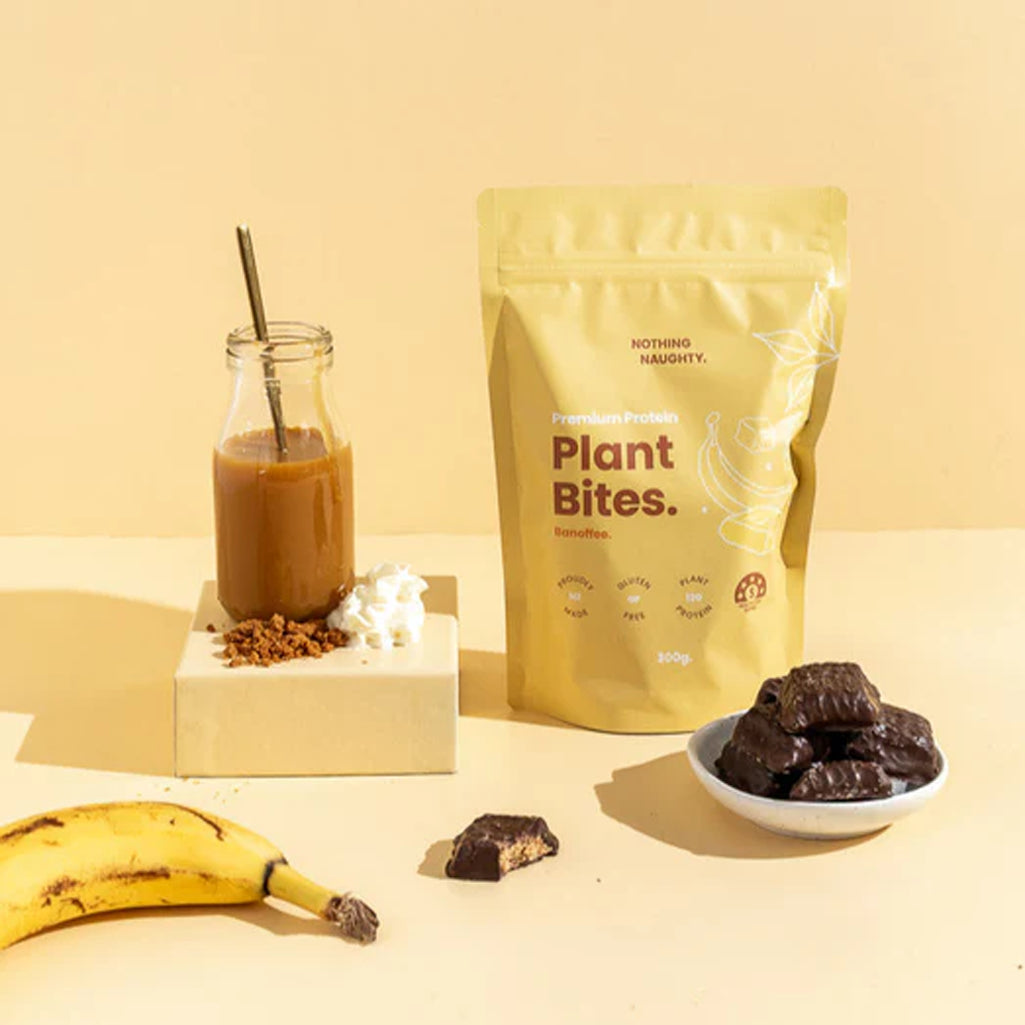 Plant-based snack package with a smoothie, banana, and bites on a yellow background