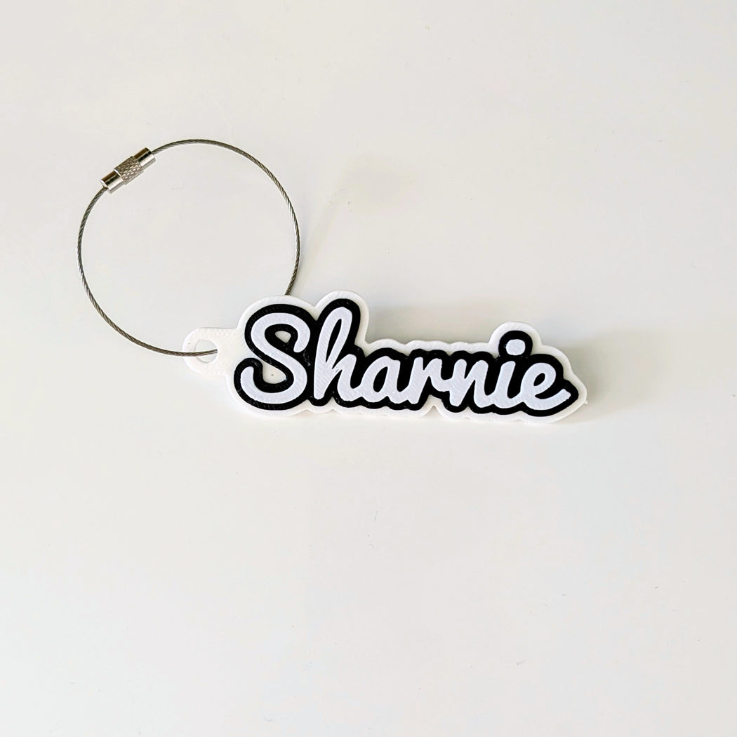 Keychain with 'Sharnie' text on a white background