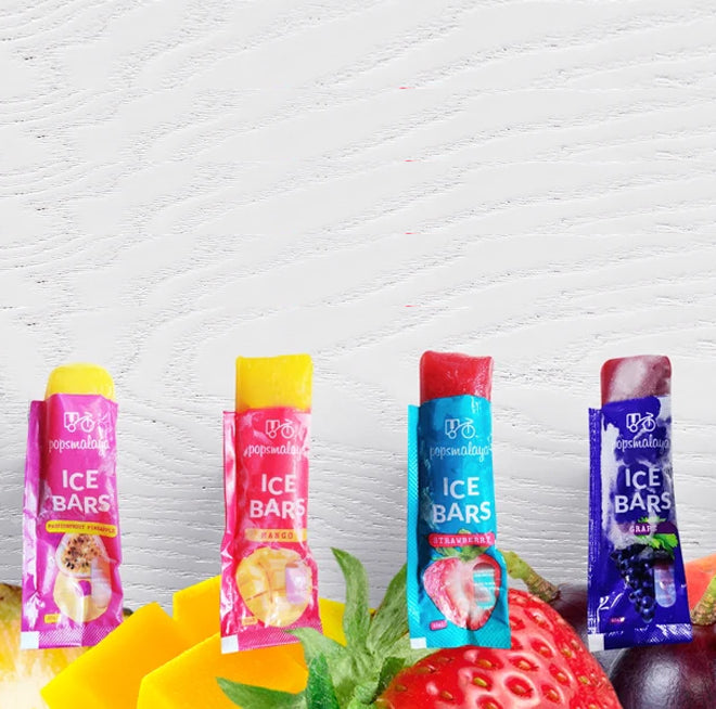 Four ice bar packages with colorful packaging on a white textured background