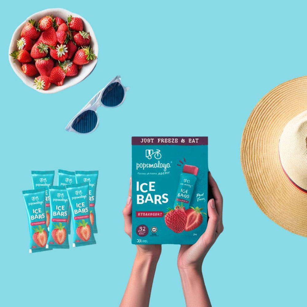 Pop Maliya ice bars packaging held by a hand with strawberries, sunglasses, and a hat on a blue background