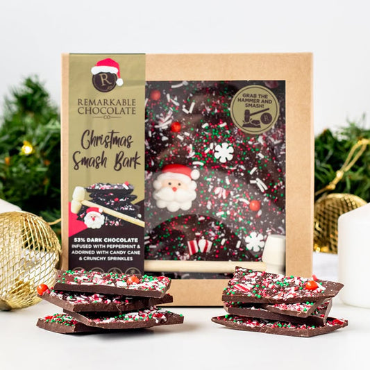Christmas-themed chocolate bark with packaging on a festive background