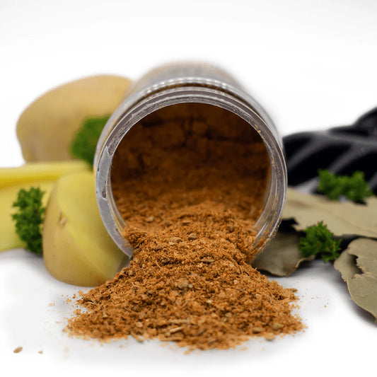 Open jar of brown powder with ingredients in the background