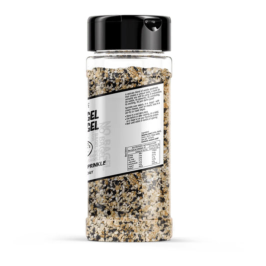 Spice container with black lid and visible seasoning on a white background