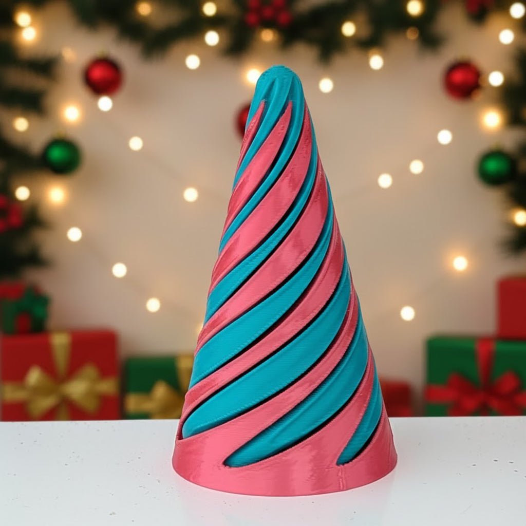 Pink and blue striped cone-shaped object on a white surface with Christmas decorations in the background.