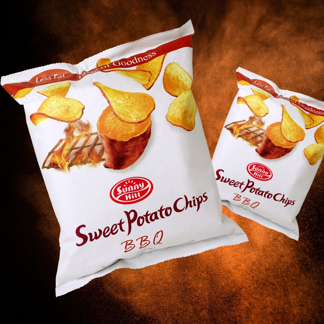 Two packages of Sunny Hill Sweet Potato Chips on a wooden surface