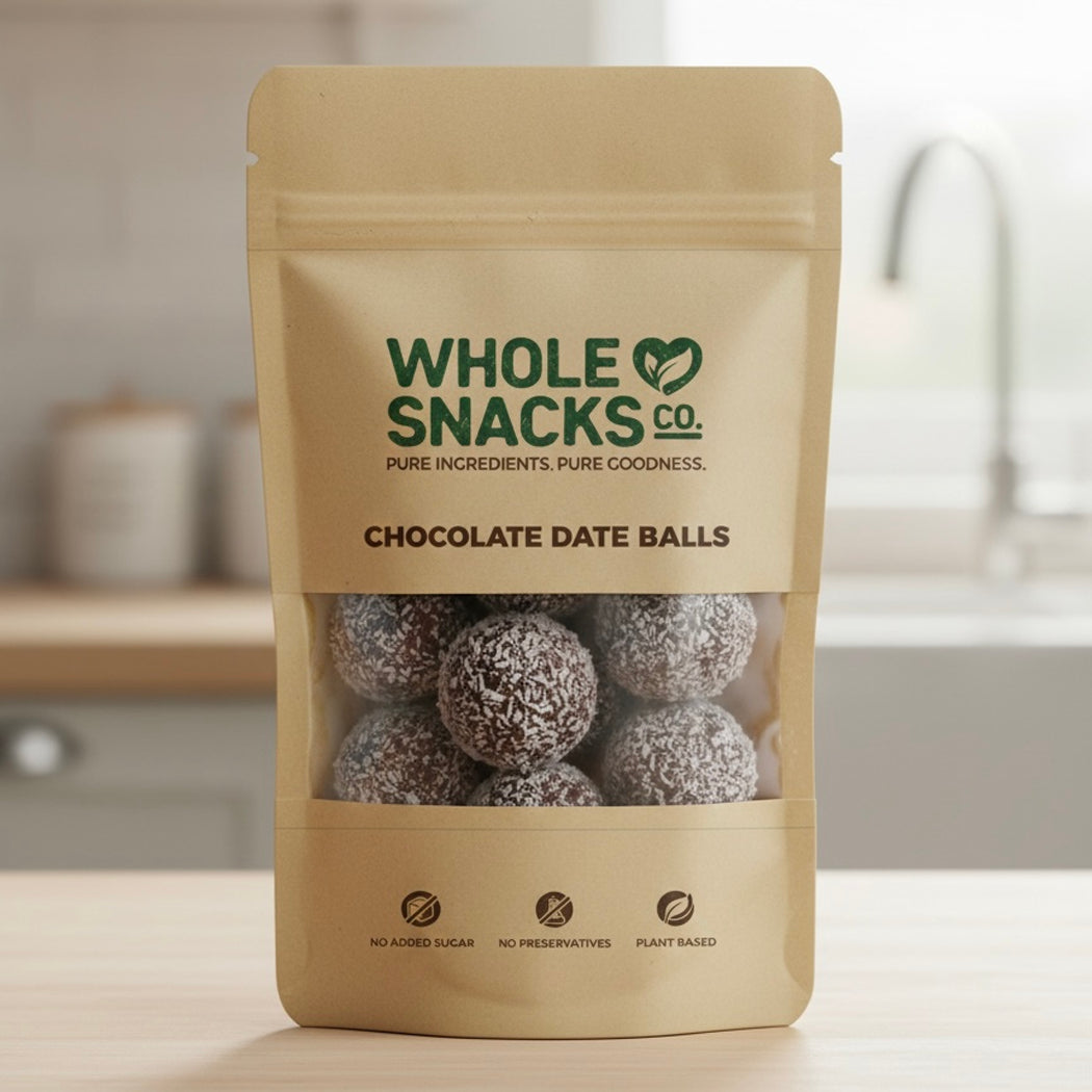 Package of Whole Snacks Co. Chocolate Date Balls on a kitchen counter.