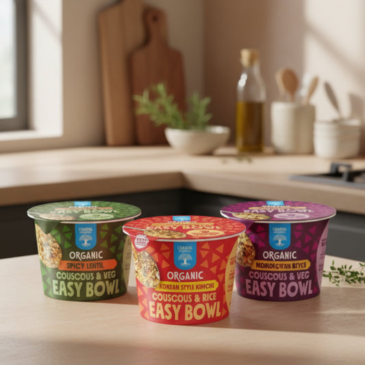 Three organic easy bowl products on a blue background