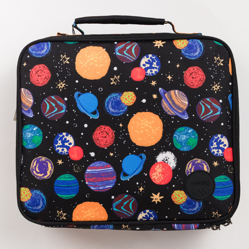 A black zippered lunch bag with a colorful space print featuring planets, stars, and white stars, shown against a plain white background.
