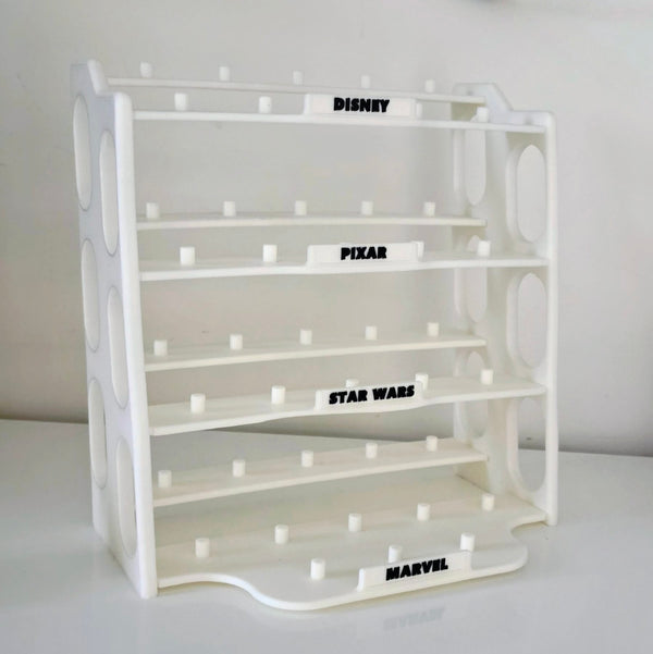 A white plastic multi-brand collectible display stand featuring shelves labeled Disney, Pixar, Star Wars, and Marvel.