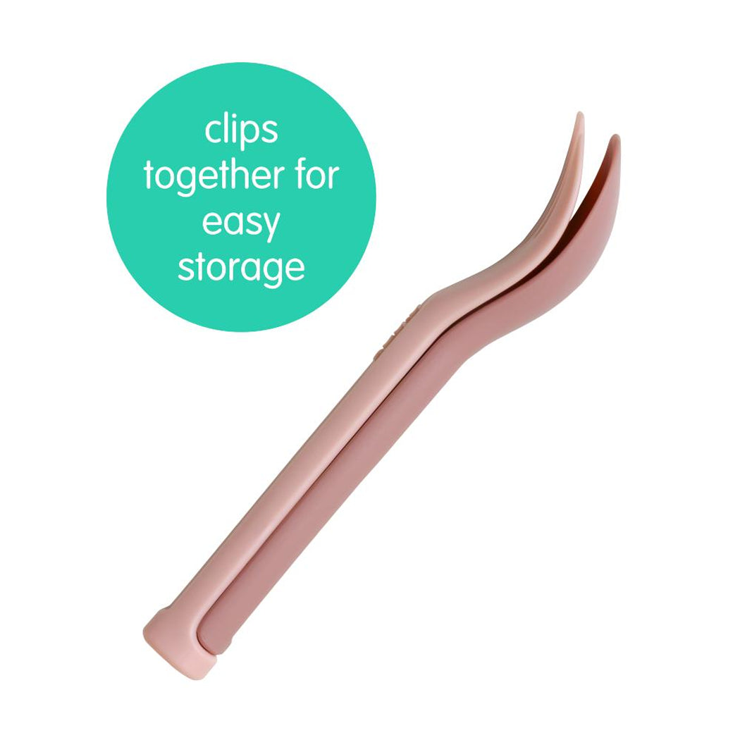 Rose gold hair clip with text 'clips together for easy storage' on a white background