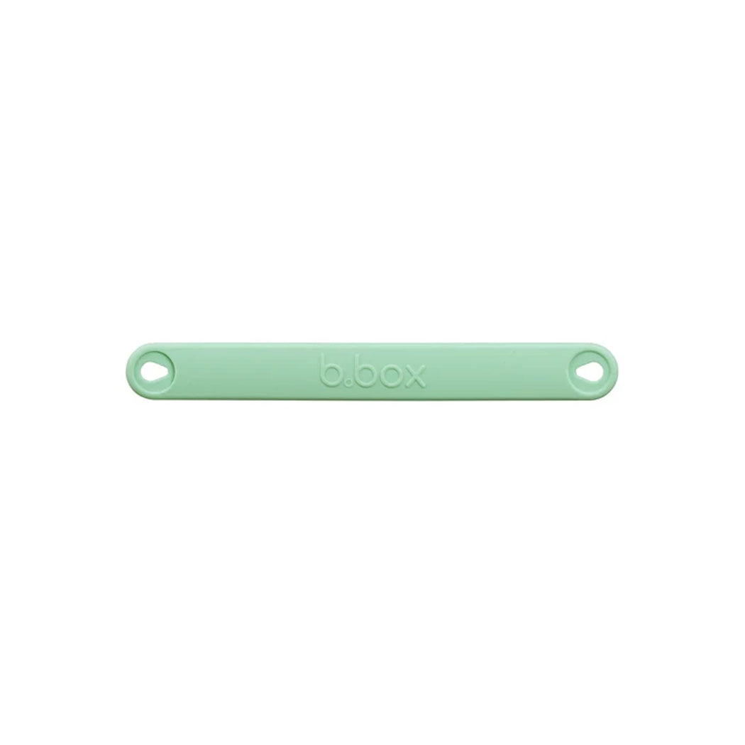 A mint green silicone protective cover for a b.box bottle opener, shown horizontally on a plain white background.