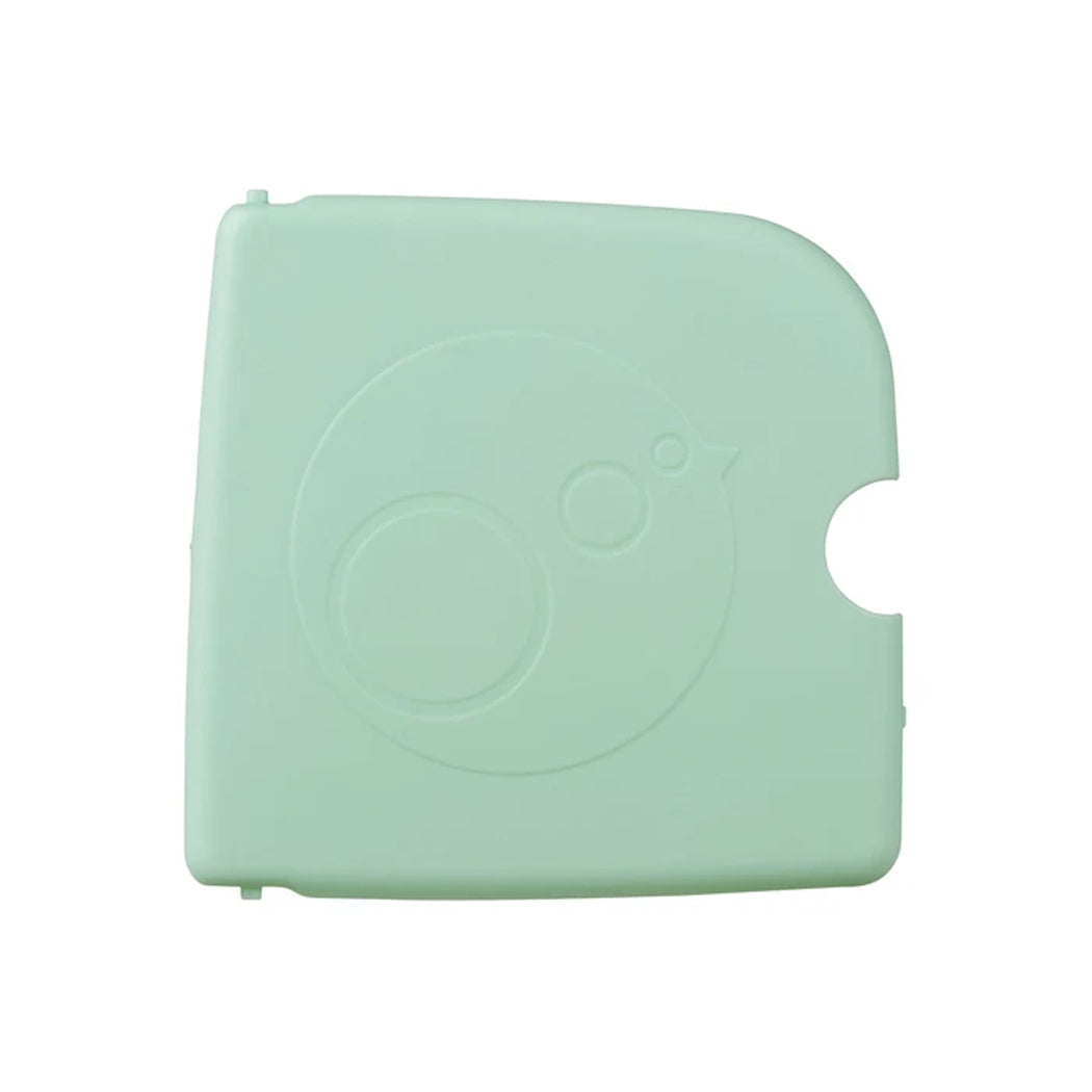 A mint green replacement protective cover for a Casely instant camera, featuring an embossed circular design and a side cutout, shown on a plain white background.