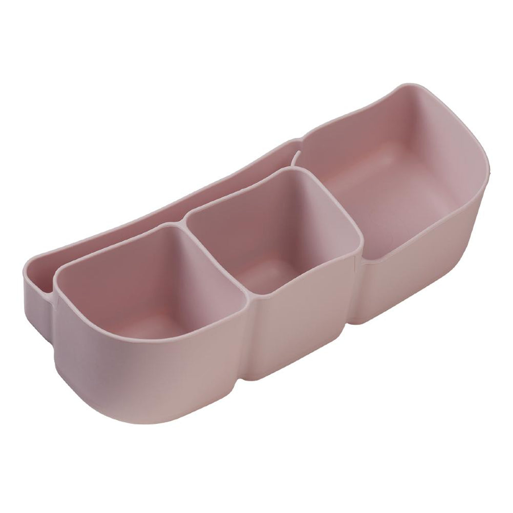 Pink silicone organizer with three compartments on a white background