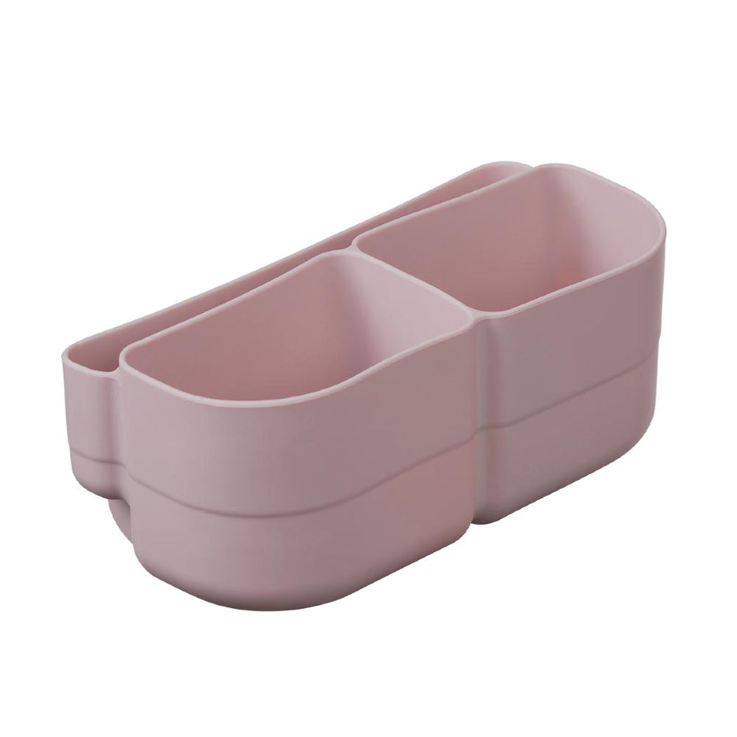 Pink plastic container with two compartments on a white background