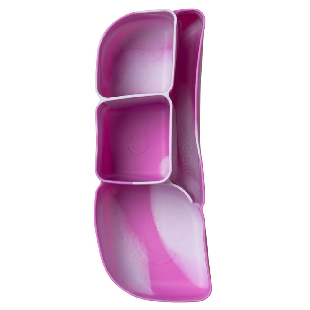 Pink silicone containerl with divided sections on a white background