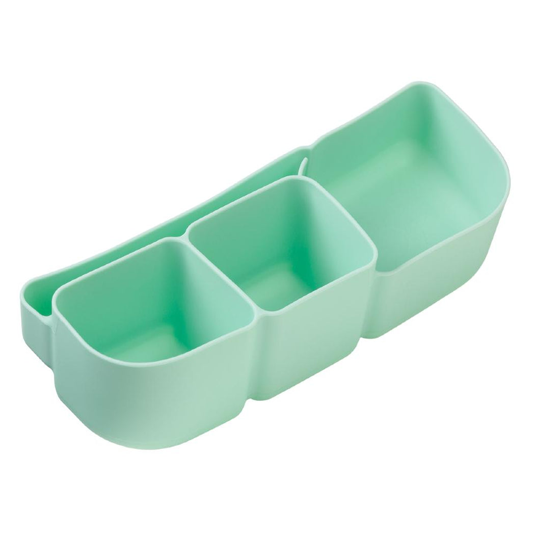 Light green silicone organiser with three compartments on a white background
