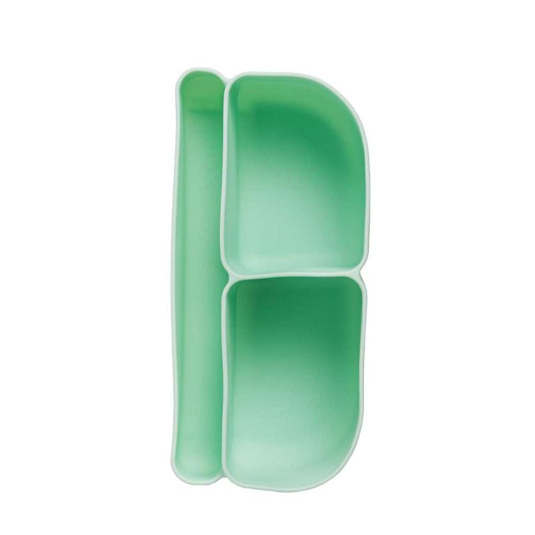 Green plastic tray with two compartments on a white background