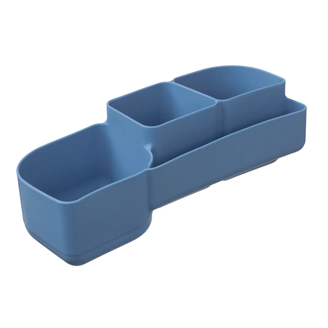 Blue silicone  compartmentalised tray on a white background