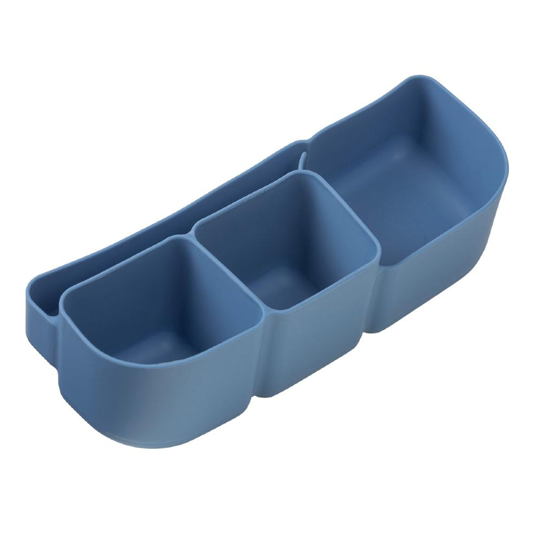 Blue silicone compartmentalised tray on a white background