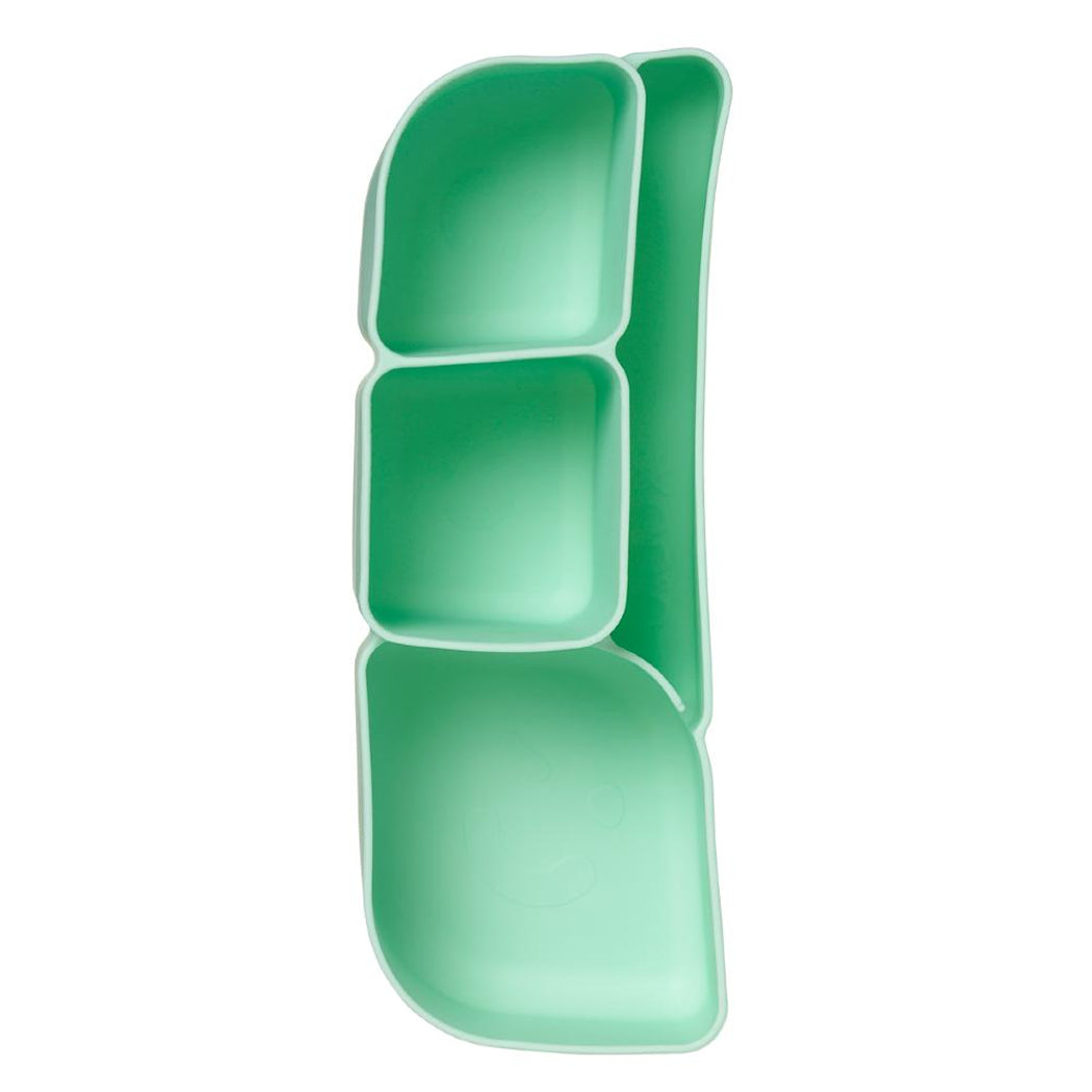 Green silicone tray with compartments on a white background