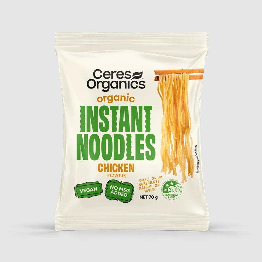 A 70g package of Ceres Organics Organic Instant Noodles Chicken Flavour, shown on a light gray background. The packaging is off-white with green and orange text, featuring a graphic of golden-yellow noodles on chopsticks.