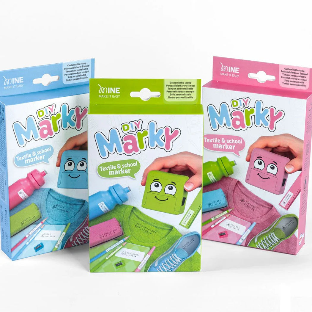 Three packages of DIY Marky textile and school markers with colorful designs and text.