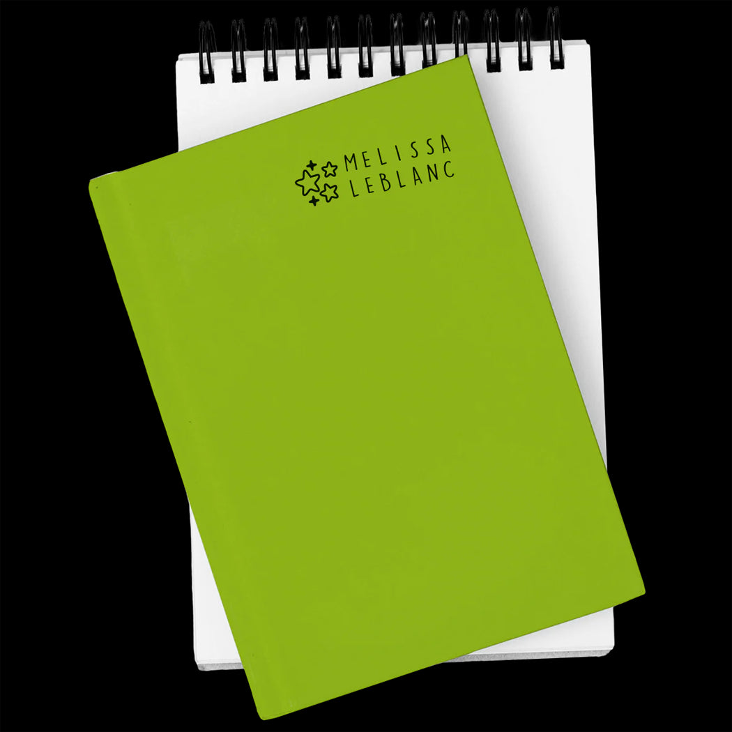 Green notebook with 'Melissa LeBlanc' branding on a white background