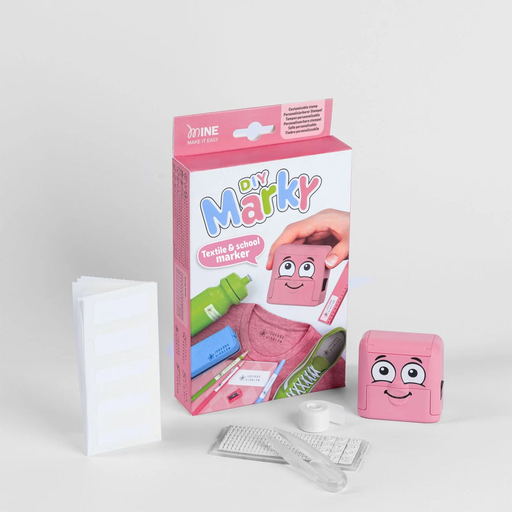 Pink 'DIY Marky' textile and school marker kit with packaging on a light gray background