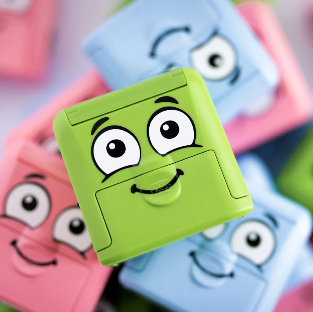 Colorful square blocks with cartoon faces on a multicolored background