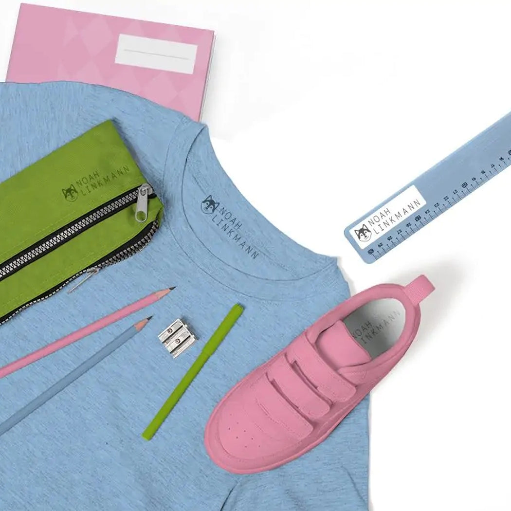 Blue shirt with pink shoes, green pencil case, pink pencils, and ruler on a white background