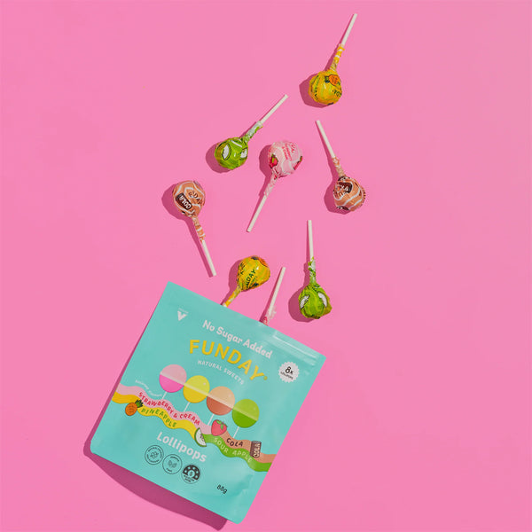 Lollipop package with colorful lollipops on a pink background