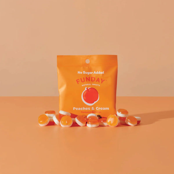 Funday peaches and cream gummy bears with an orange package on a peach background