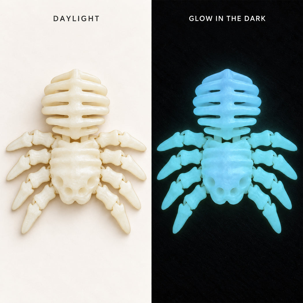 A split comparison of a spider-shaped object under normal light and glow-in-the-dark conditions. The left side labeled 'DAYLIGHT' shows the item in off-white/cream under normal lighting, and the right side labeled 'GLOW IN THE DARK' shows it glowing bright cyan-blue against a black background.