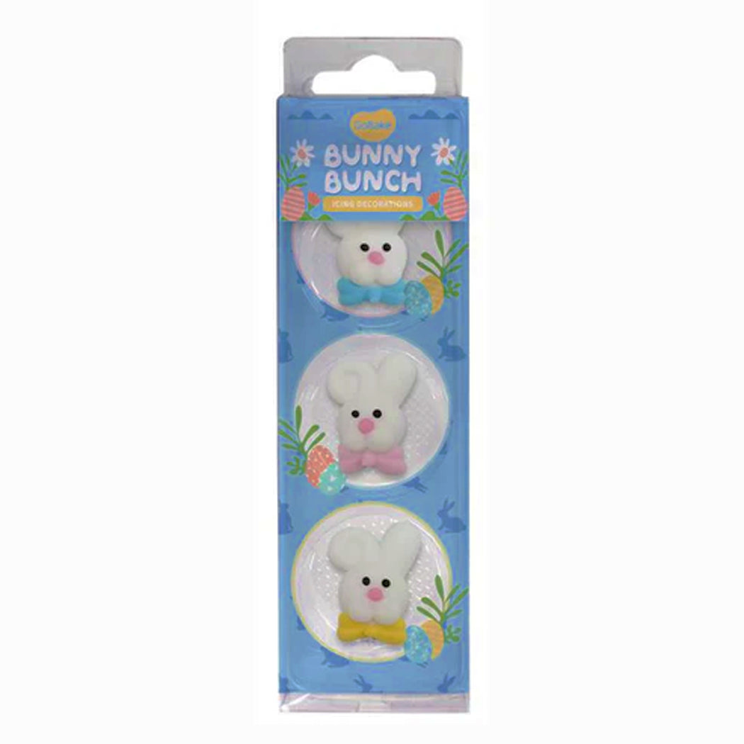 Packaged toy bunnies with colorful bows on a blue background