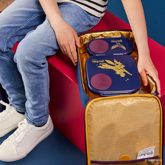 Person opening a lunch bag with a branded design on a red and blue background