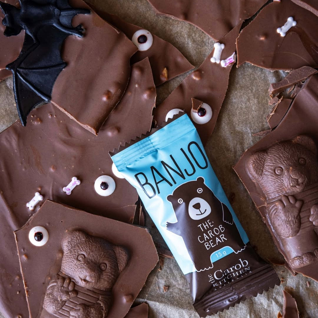 Chocolate bars with a 'Banjo' packaging featuring a bear design on a textured surface.